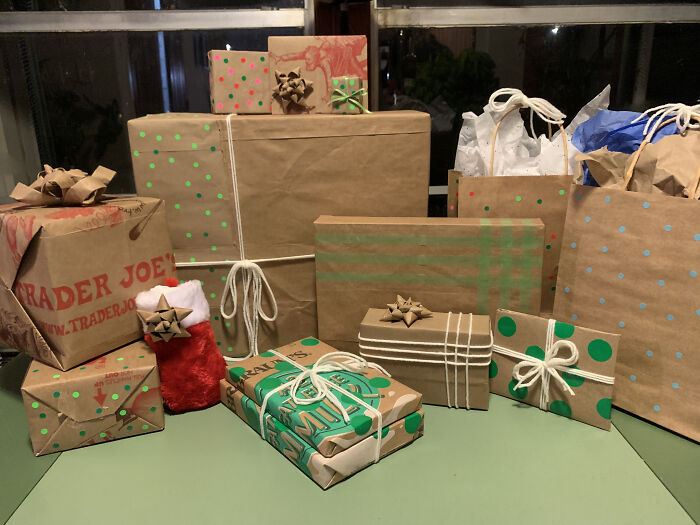 Gifts wrapped in brown paper and recycled bags, symbolizing a shift away from consumerism.