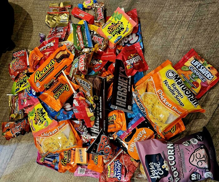 Assorted snacks and candies, including Reese's, Twix, and ramen noodles, providing mildly interesting visual amusement.