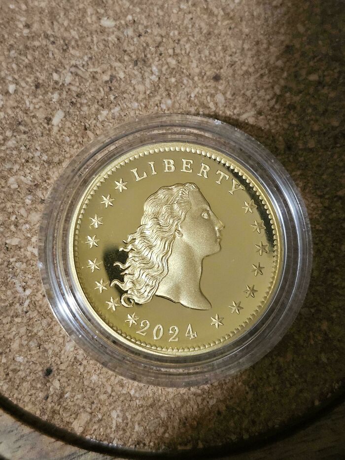 Gold coin from 2024 with Liberty design, mildly interesting object for temperate amusement.