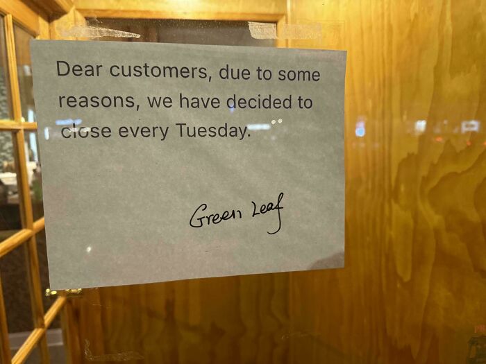 Notice on a door stating closure every Tuesday signed by Green Leaf; mildly interesting.