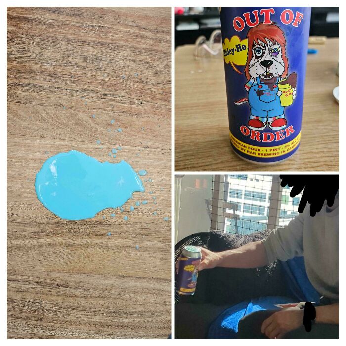 A spilled blue drink next to a can labeled 'Out of Order' with a cartoon dog. Mildly interesting beverage mishap.