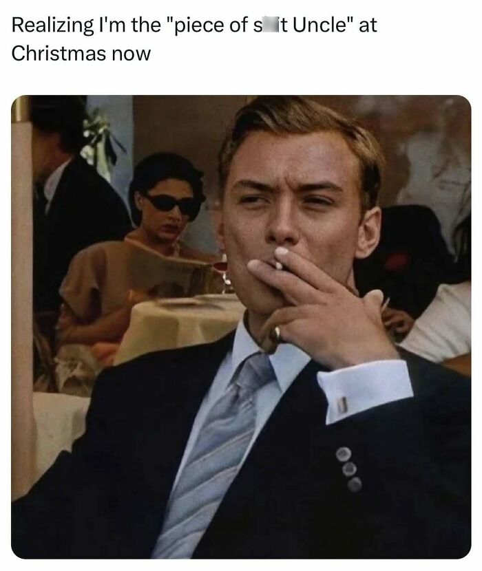 Man in a suit smoking, realizing he's the "piece of s**t uncle" at Christmas now; funny and relatable meme for men.