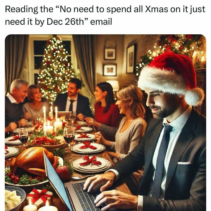 Man in Santa hat at Christmas dinner, reading a work email on his laptop. Wall Street meme humor.