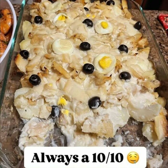 Unappetizing food photo with mixed ingredients, eggs, and black olives labeled "Always a 10/10" in a glass dish.