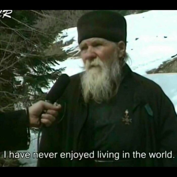 Elderly man with a long white beard being interviewed outdoors, captioned with a relatable funny meme about life struggles.