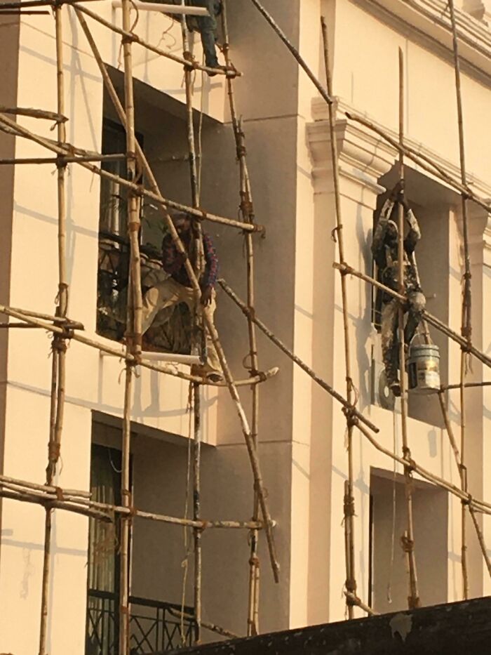 Working 11 Floors High On Bamboo Scaffolding And None Of Them Have Their Safety Line Connected