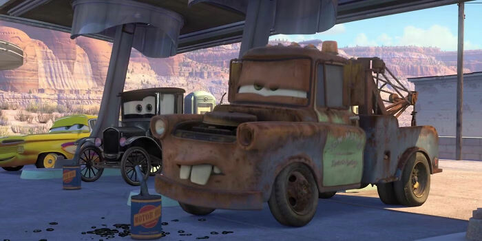 Animated cars with humorous expressions at a gas station, referencing movie jokes.