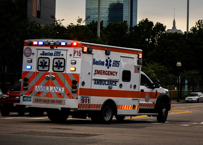 Ambulance in city traffic, reminding of memorable 911 dispatcher calls.