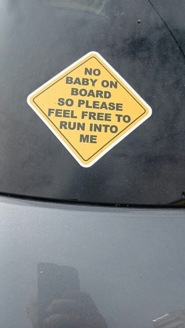 Weird and absurd car sign reads, "No baby on board, so please feel free to run into me."