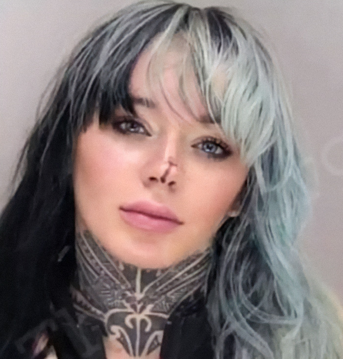 Abbie Newman with multicolored hair and neck tattoo, part of viral mugshots of criminal heartthrobs collection.