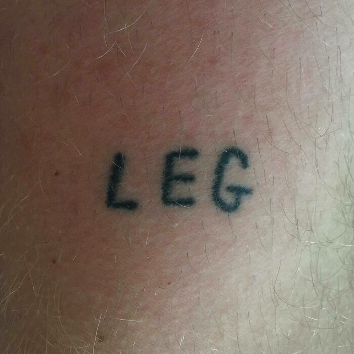 "Funny worst tattoo fail with the word 'LEG' inked on a leg."