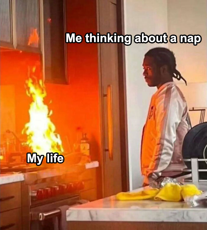 Person staring at a kitchen fire with the text overlay "Me thinking about a nap" and "My life," from a mental health meme page.