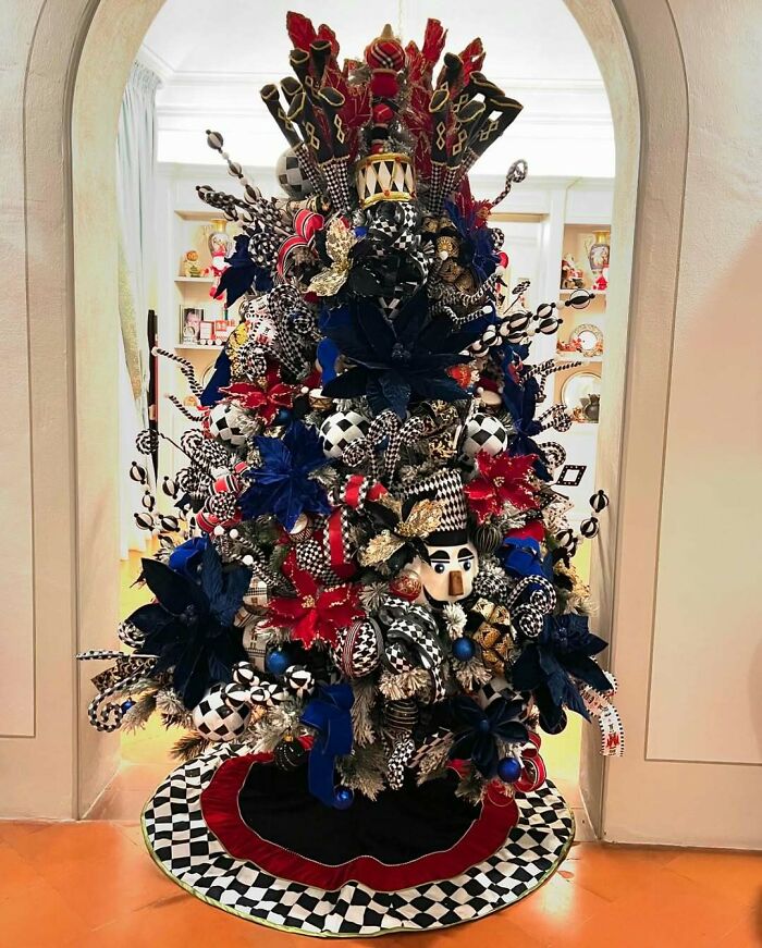 Festive Christmas tree adorned with colorful, eclectic decorations in a creative and unique design.