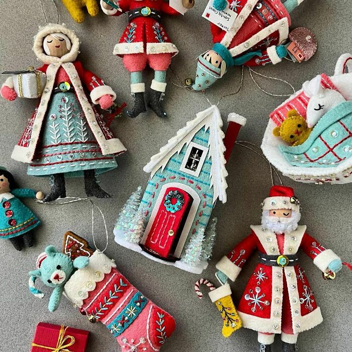 Handmade felt Christmas ornaments including Santa, a house, and stockings showcasing creative DIY Christmas decorations.
