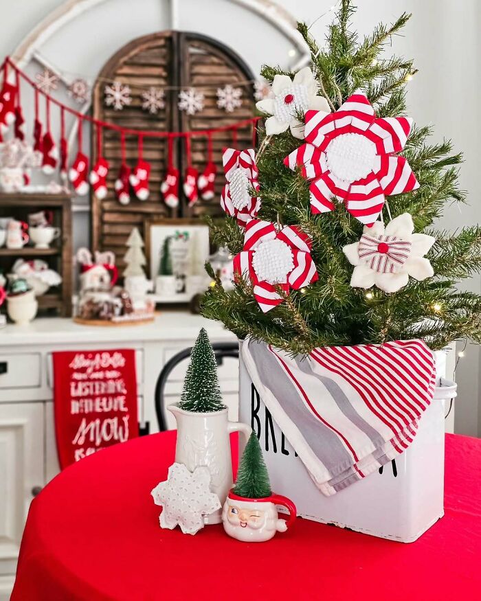 Creative DIY Christmas decorations with red and white theme, featuring a small tree and festive handmade ornaments.