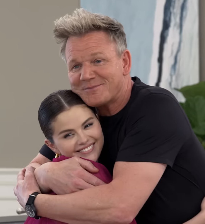 Chef Gordon Ramsay hugging Selena Gomez in a cozy setting.