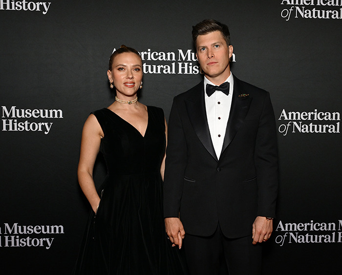 Colin Jost and Scarlett Johansson at the American Museum of Natural History event, dressed in formal attire.