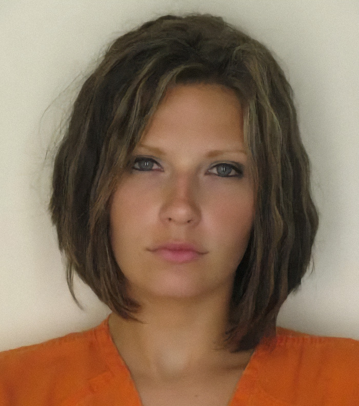Meagan Simmons in a mugshot wearing an orange jumpsuit, representing viral mugshots of criminal heartthrobs.