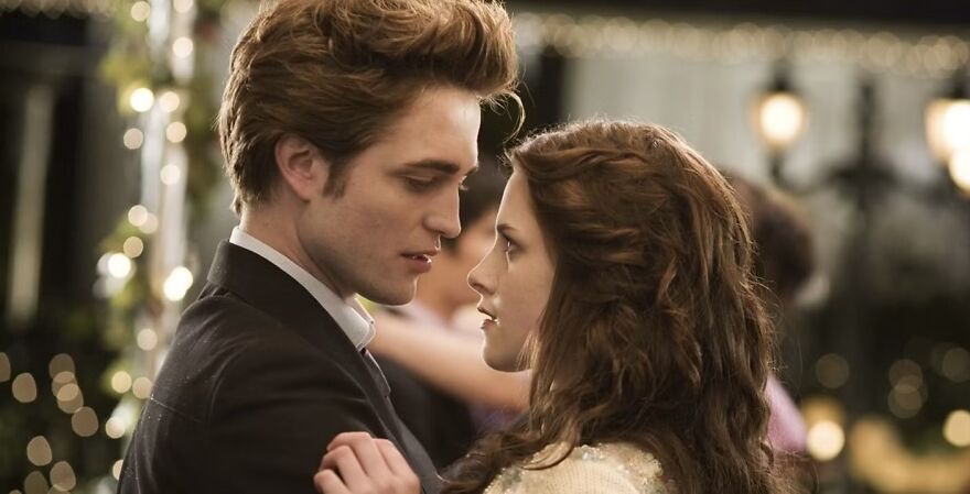 Couple from a movie sharing an intimate moment, capturing a romantic scene in Twilight.