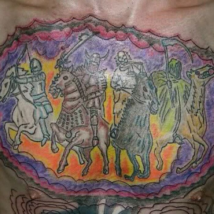 Four warriors in colorful worst tattoo fails design on a chest.