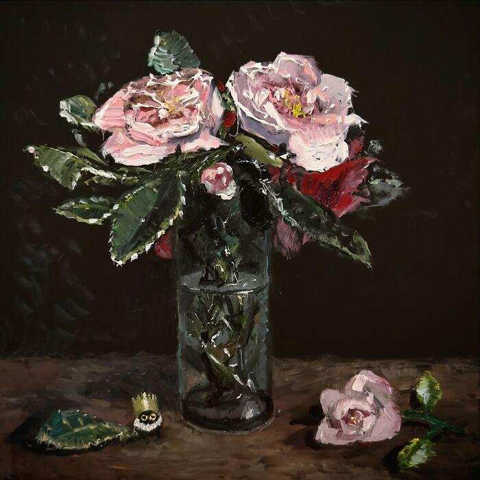 Chaotic black cat painting with a vase of flowers and a small cat figure nearby.