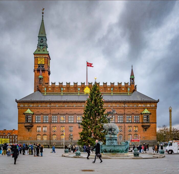Christmas tree in front of a historic building in Copenhagen one of the 29 cities around the globe.