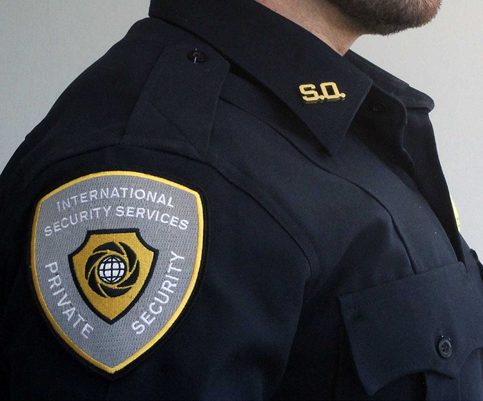 Security expert in uniform with "International Private Security Services" patch. Security expert in uniform with "International Private Security Services" patch.