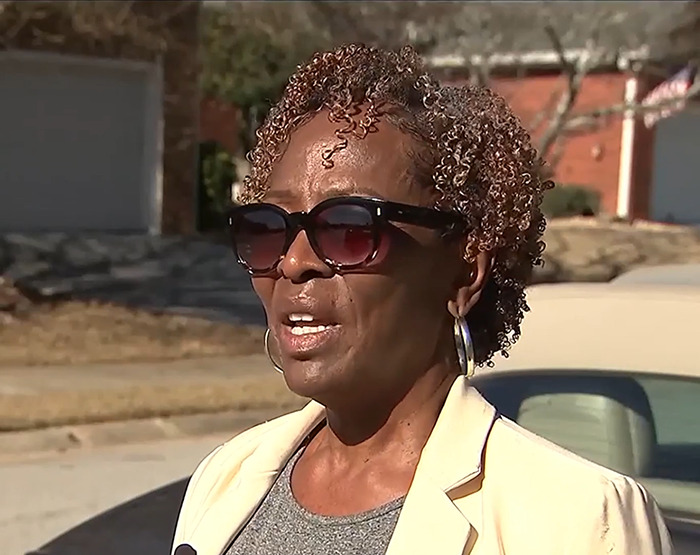 Loletha Hale wearing sunglasses outside, related to squatter home reclaiming incident. Loletha Hale wearing sunglasses outside, related to squatter home reclaiming incident.