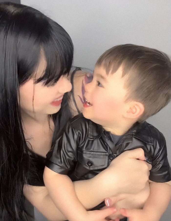 Nebrazkha holds her baby.