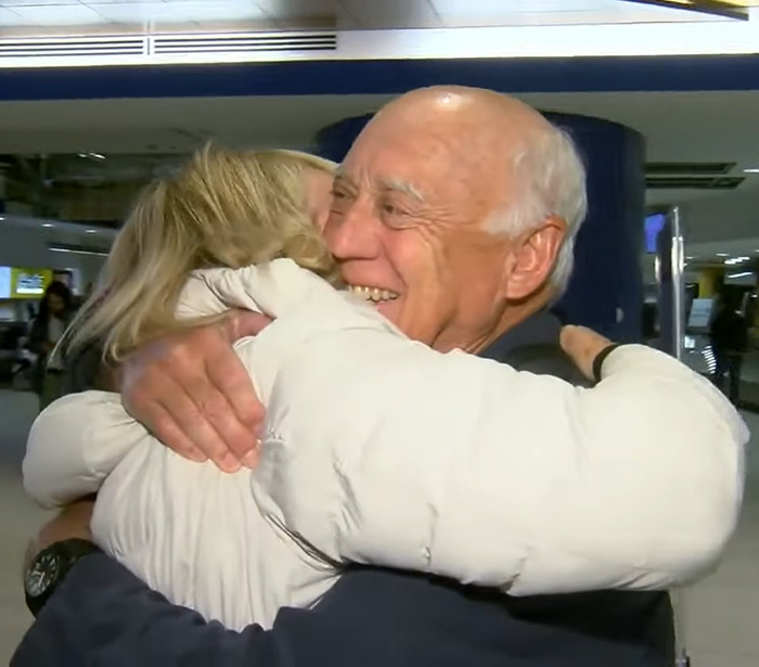 Dixon Handshaw reunites with family member, embracing happily after 75 years apart in an emotional airport reunion.