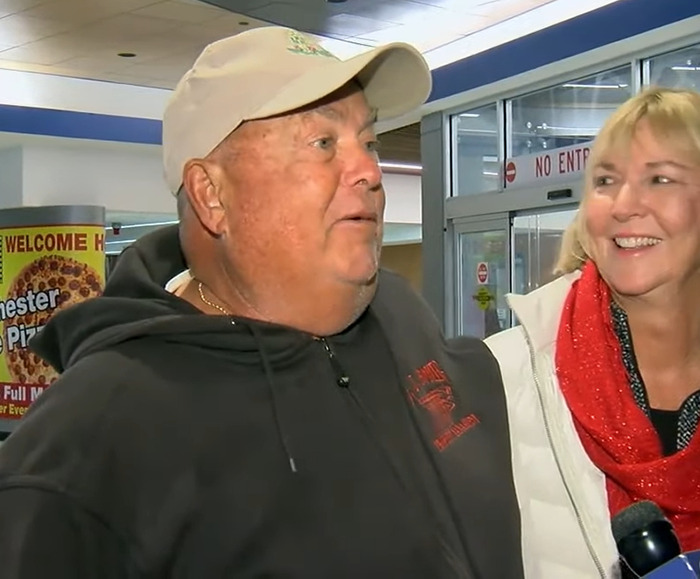 Man and woman smiles, celebrating a family reunion after 75 years.