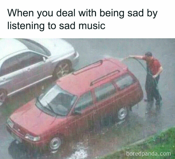 Funny and relatable meme of a person washing a car in the rain, capturing irony and humor.