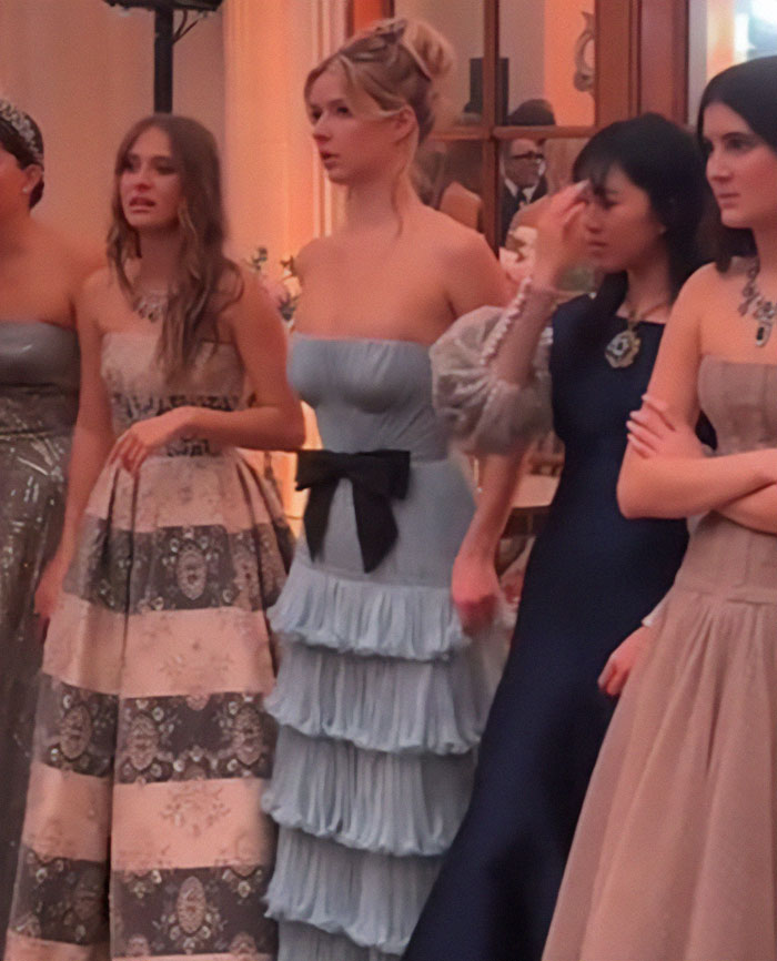Apple Martin and other debutantes in elegant dresses at a Paris ball, related to Gwyneth Paltrow's daughter in social media critique. Apple Martin and other debutantes in elegant dresses at a Paris ball, related to Gwyneth Paltrow's daughter in social media critique.