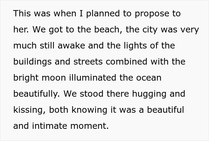 Text about a romantic beach proposal illuminated by city lights and the moon.