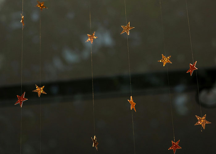 Stars hanging in someone's home, creating a surprising and decorative display.