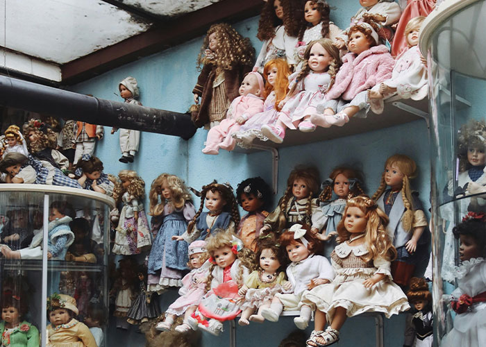 Collection of vintage dolls displayed in a surprising home setup.