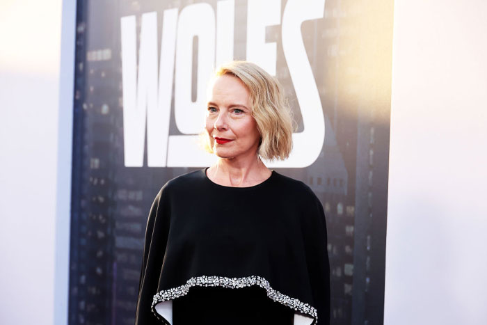 Actress in a black dress at an event, linked to the cast of Only Murders in the Building Season 4.