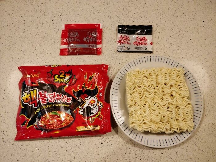 Instant ramen packet with noodles and seasoning, representing an insulting benefit or bonus.