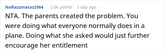 Reddit comment discussing child tantrum on plane and parent entitlement, gaining 2.6k points.