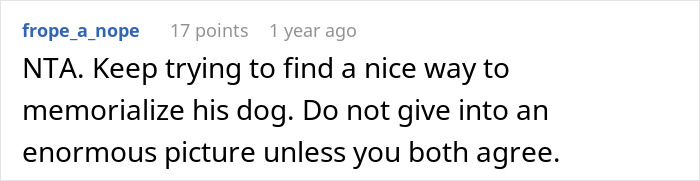 Comment discussing a woman's dislike for a large dog photo in the apartment. Comment discussing a woman's dislike for a large dog photo in the apartment.