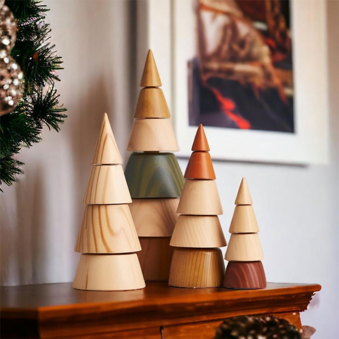Wooden cone trees on a shelf, showcasing creative DIY Christmas decorations.