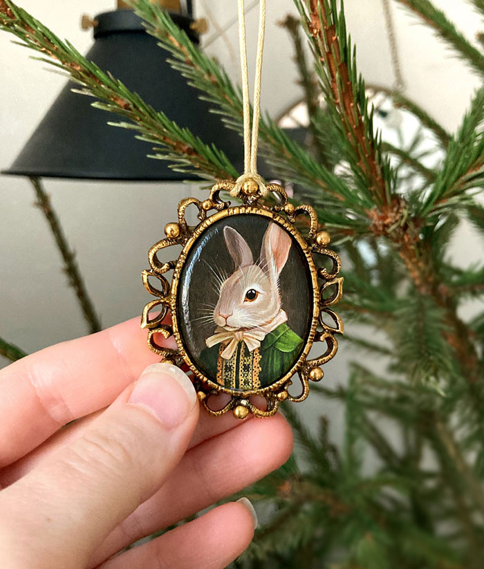 Close-up of a handmade Christmas ornament featuring a rabbit portrait, illustrating creative DIY decorations.