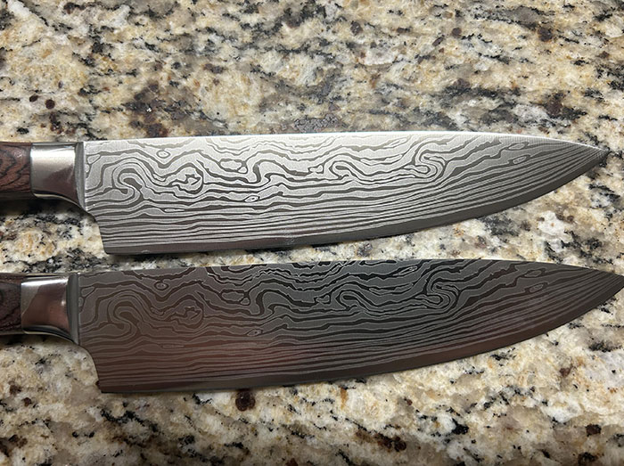 Two patterned kitchen knives on a granite countertop, capturing the theme of disappointing gifts.