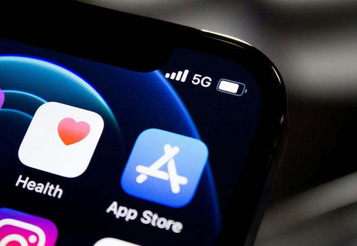 Close-up of smartphone screen displaying Health and App Store icons, symbolizing common customer queries.