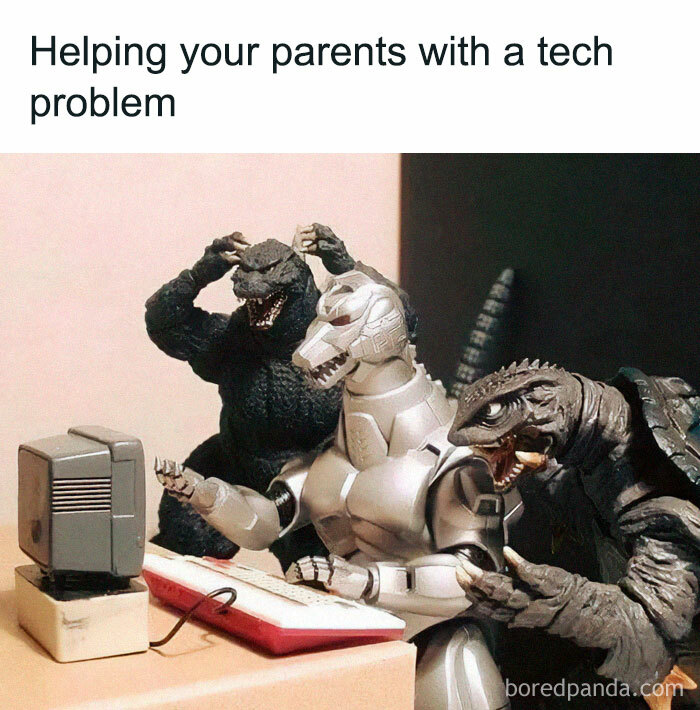 Dinosaurs humorously gathered around an old computer, parodying tech support struggles.