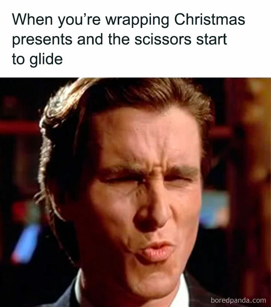 Close-up of a person making a funny face, capturing the hilarious moment of wrapping Christmas gifts with smoothly gliding scissors.