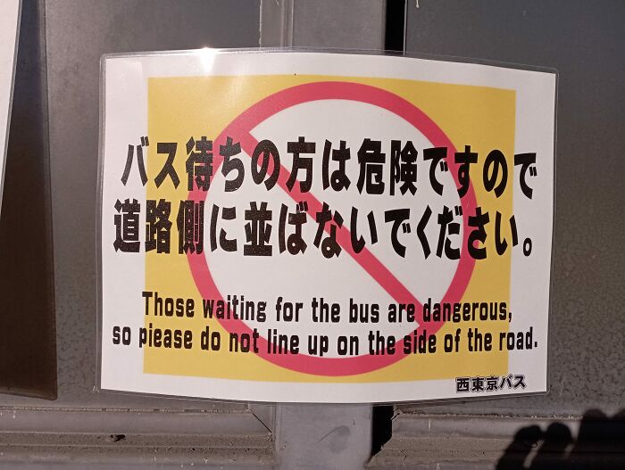 Sign in Japan with humorous translation about waiting for buses.