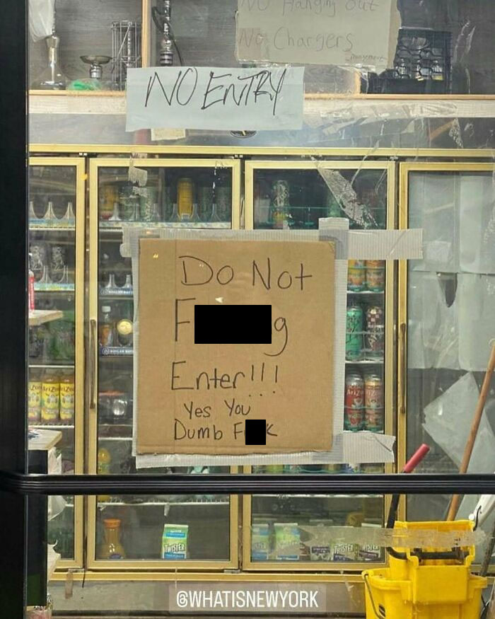 Sign in a New York store window with humorous and blunt language.