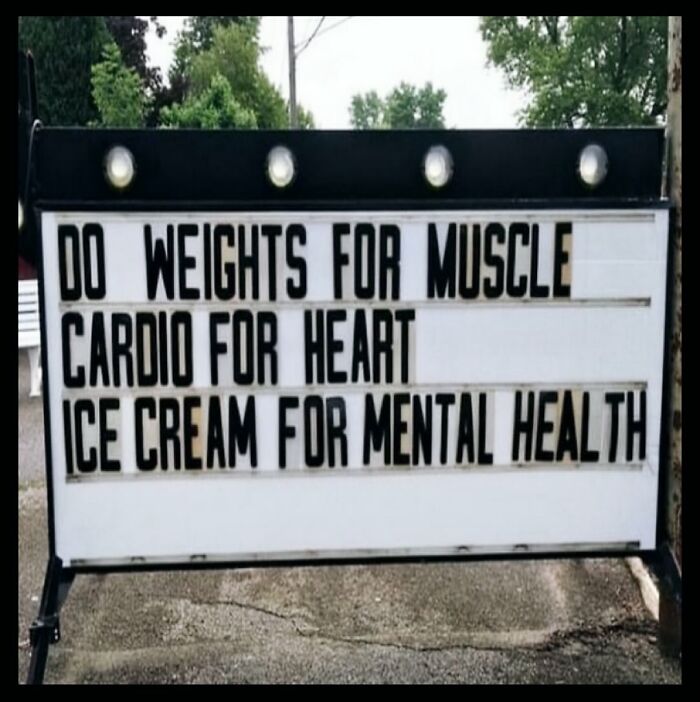 Sign with dieting meme: "Do weights for muscle, cardio for heart, ice cream for mental health."