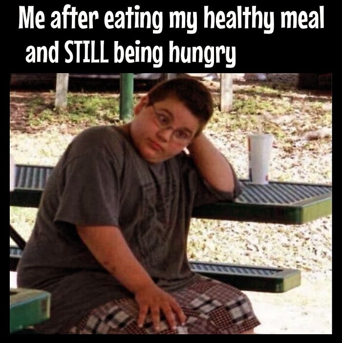 A boy looking frustrated after eating a healthy meal, capturing dieting frustrations with a humorous touch.